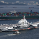 China's aircraft carrier Liaoning sails past a container ship as it enters Hong Kong, China July 7, 2017.